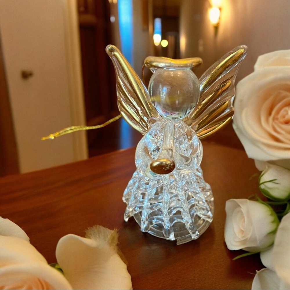 Lovely spun glass angel ornament blowing a trumpet trimmed in gold